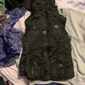 Its a warm thick very soft multiple pocket vest